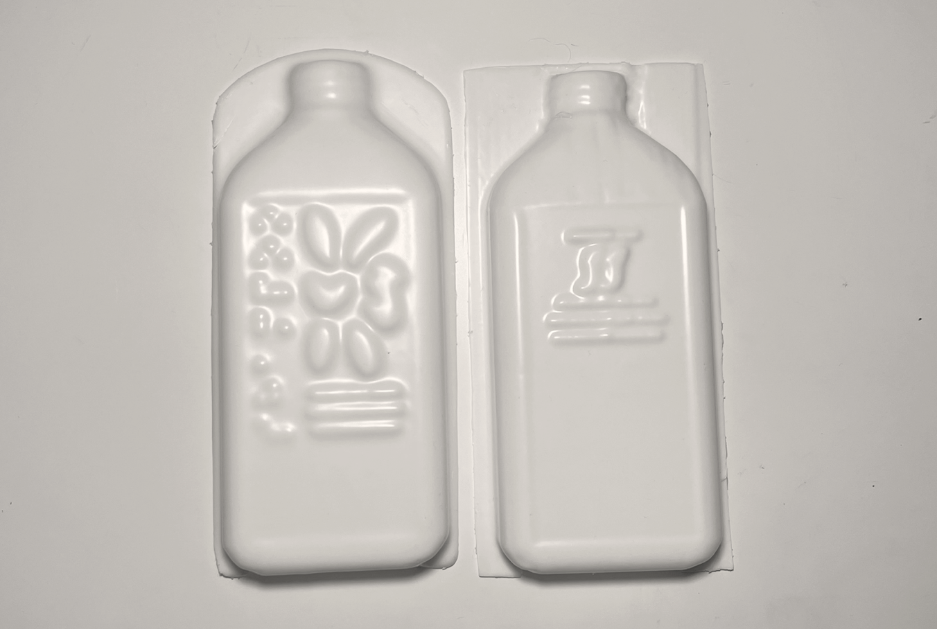 Flower Form white plastic shampoo moulds, front and back
